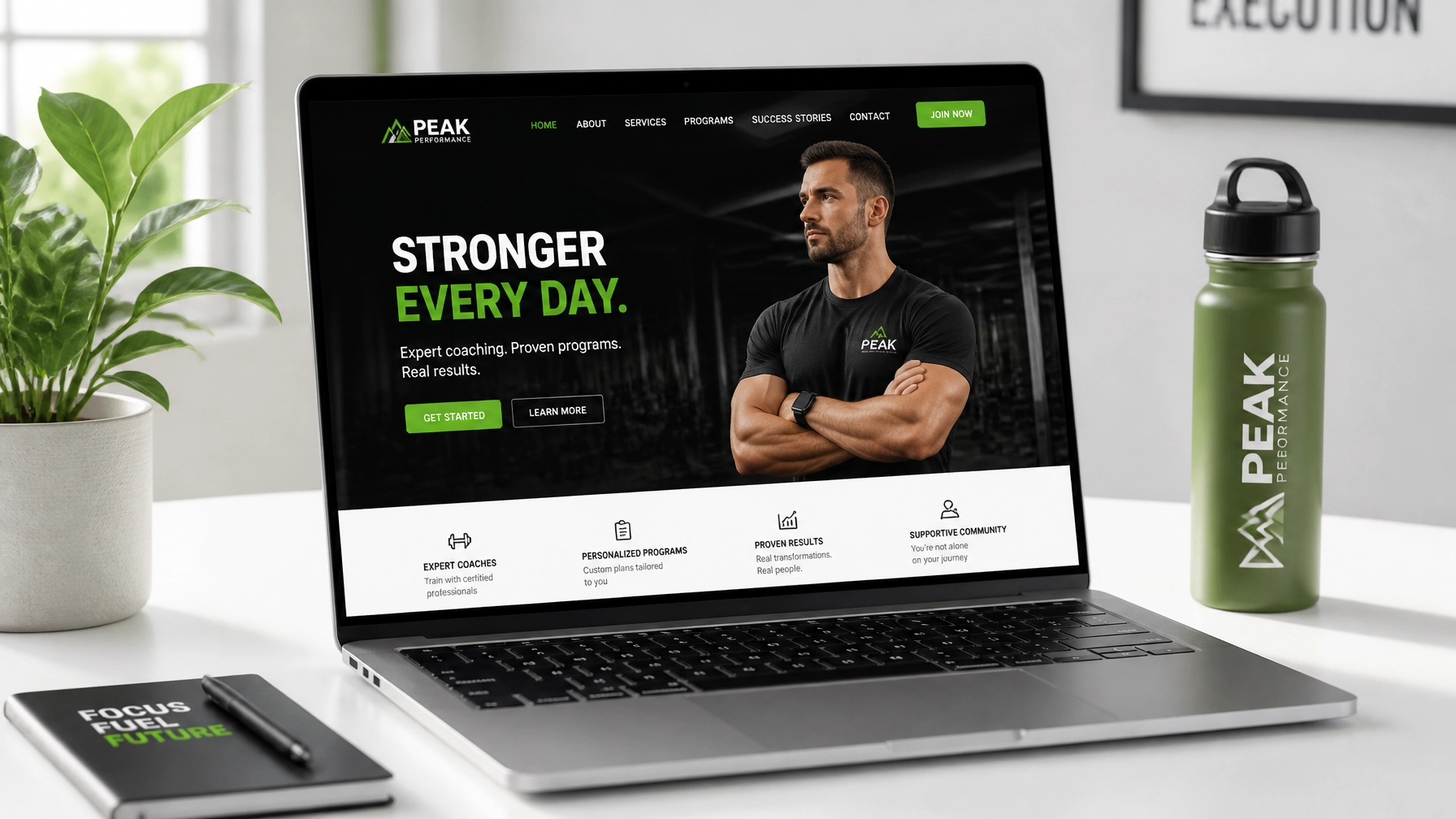 A professional laptop showing a clean gym website layout on a white desk