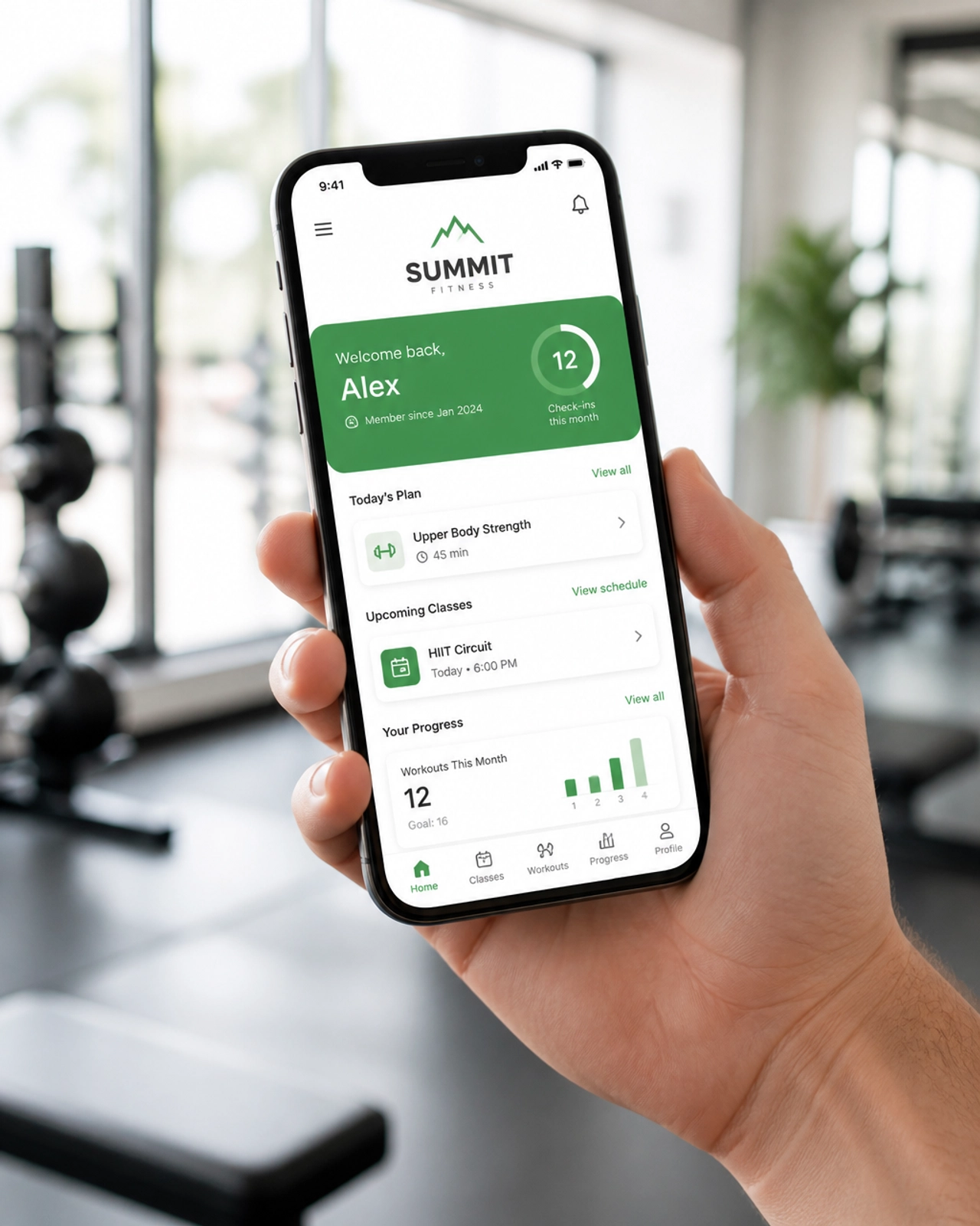 A person holding a smartphone that displays a custom-designed mobile app for a local gym, featuring class schedules and booking options.