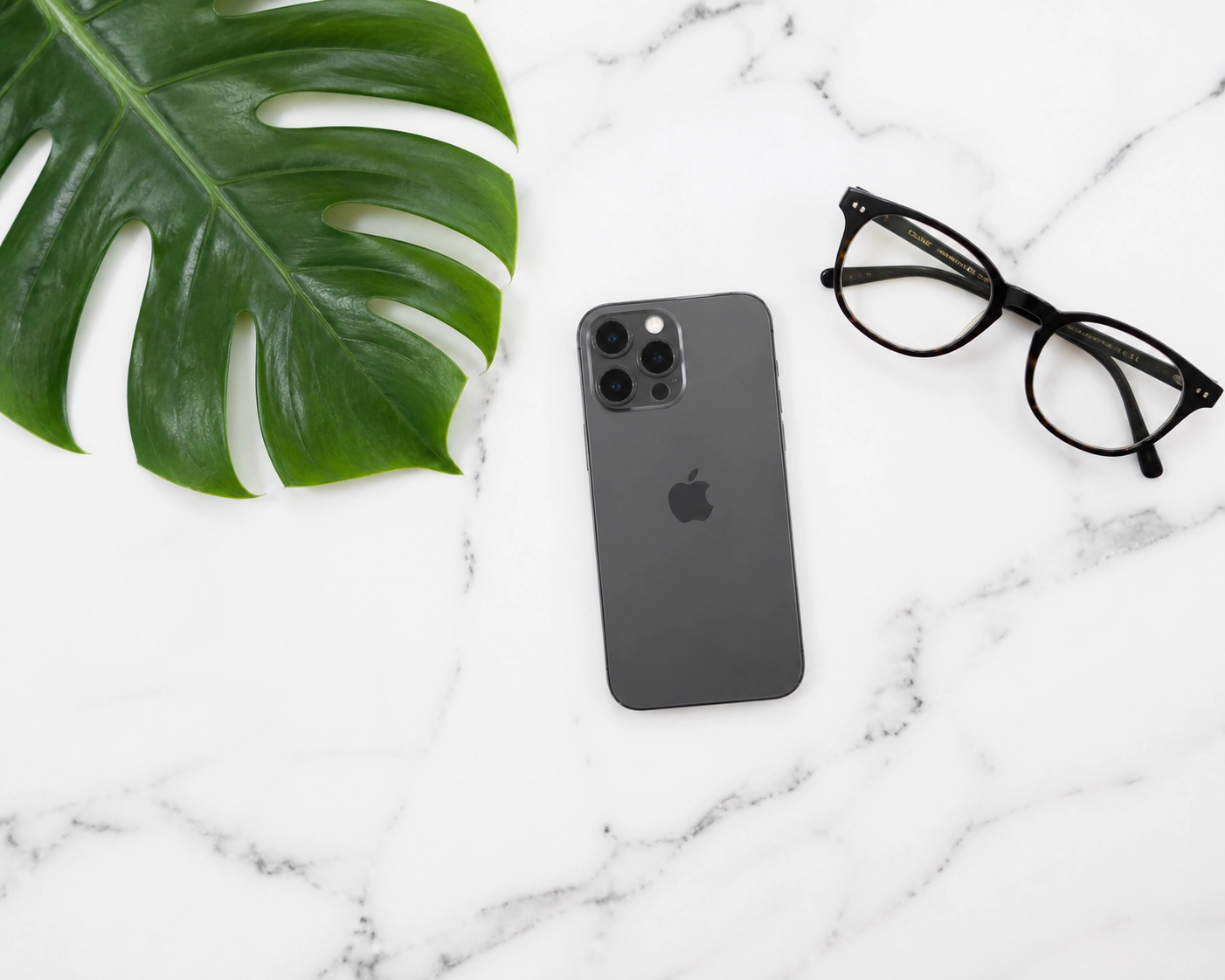 Minimalist desk setup with a smartphone symbolizing digital growth and automated booking systems.