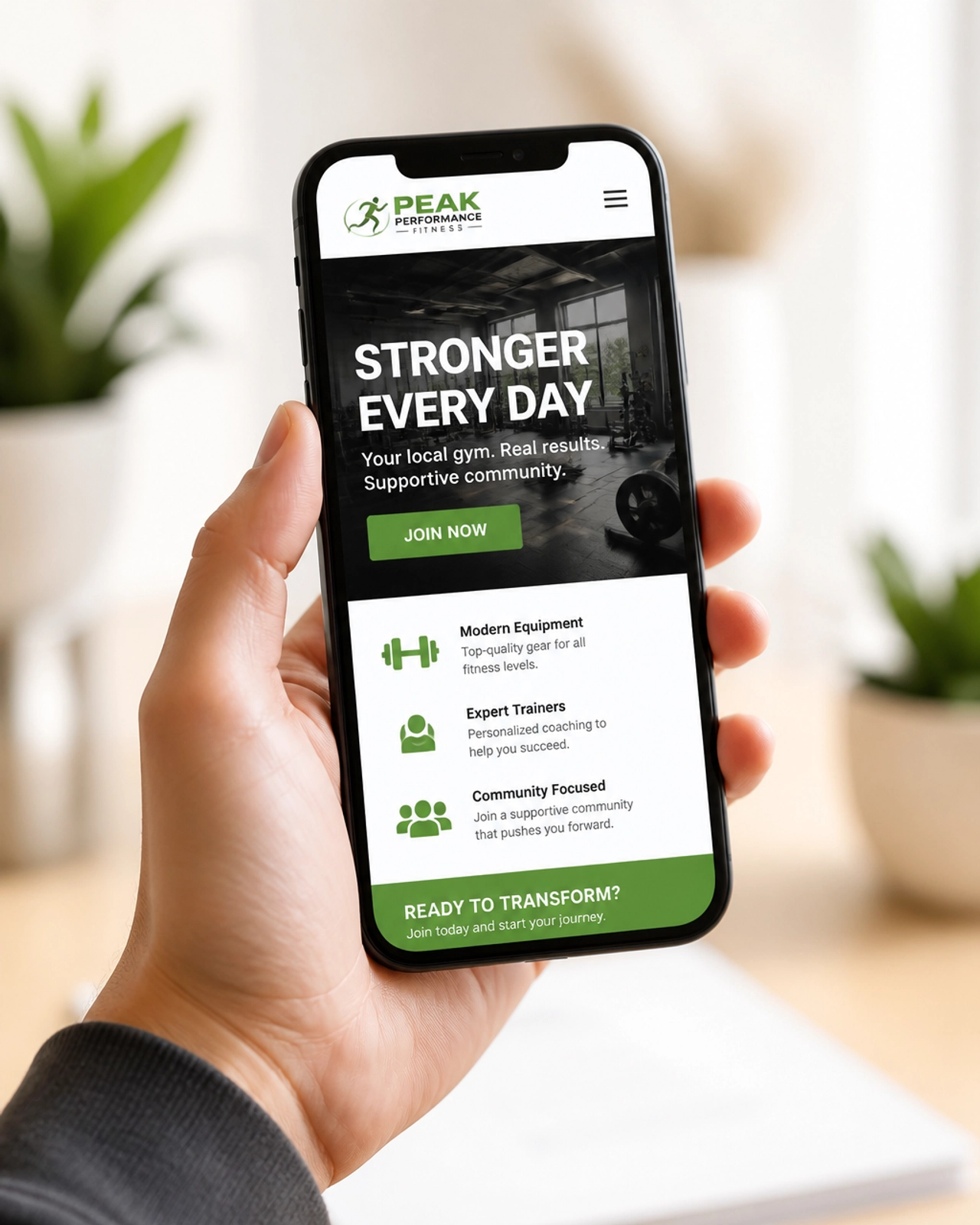 A smartphone showing a mobile-optimized gym website with a clear call to action
