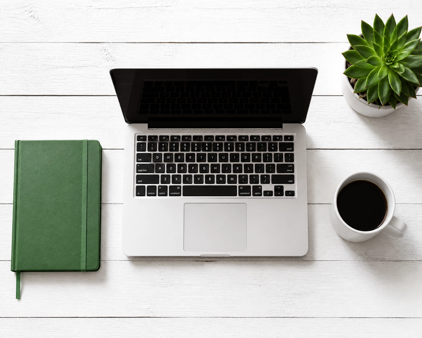 Clean workspace with a laptop showcasing the benefits of minimalist website design and removing digital noise.