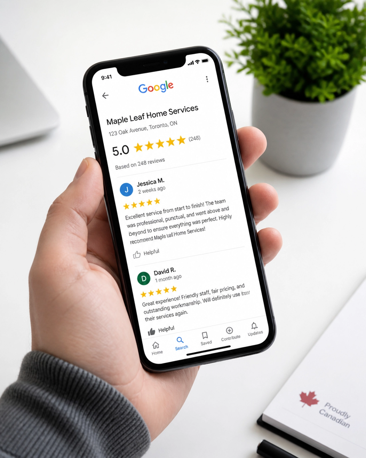 A person's hand holding a smartphone displaying a 5-star Google Review page for a local service business.